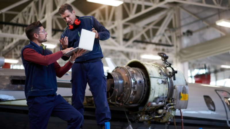 Two men in aerospace service uniforms